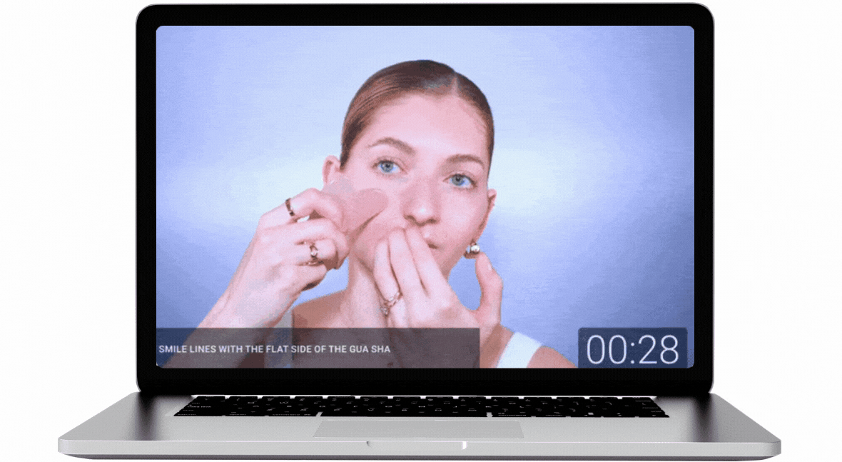 image of Valeriia using Gua Sha on her face