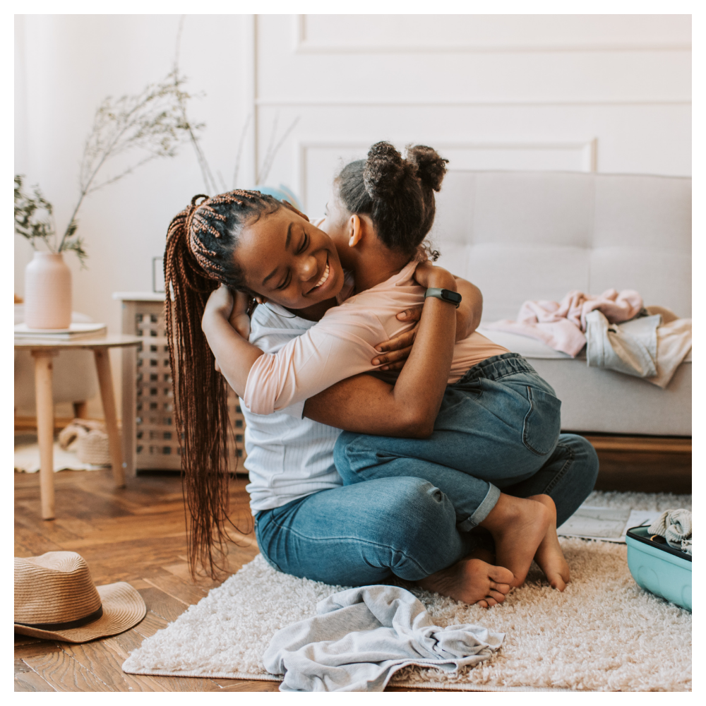 Mother and daughter hugging in a cozy bedroom, representing emotional connection, intentional parenting, and meaningful family moments inspired by Serenely Rooted.