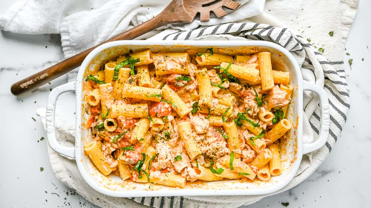 Salmon, cherry tomatoes, feta and pasta bake