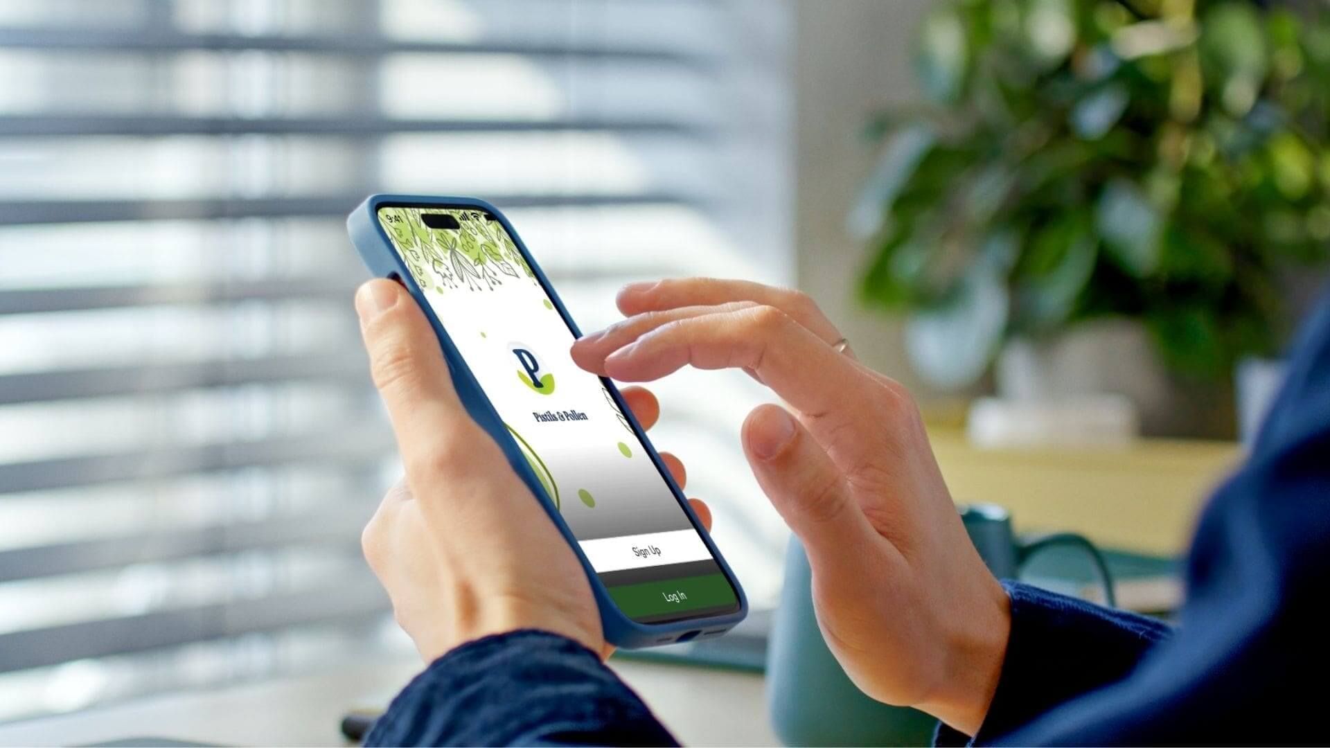 Hand of a woman tapping on her mobile screen to login to the app