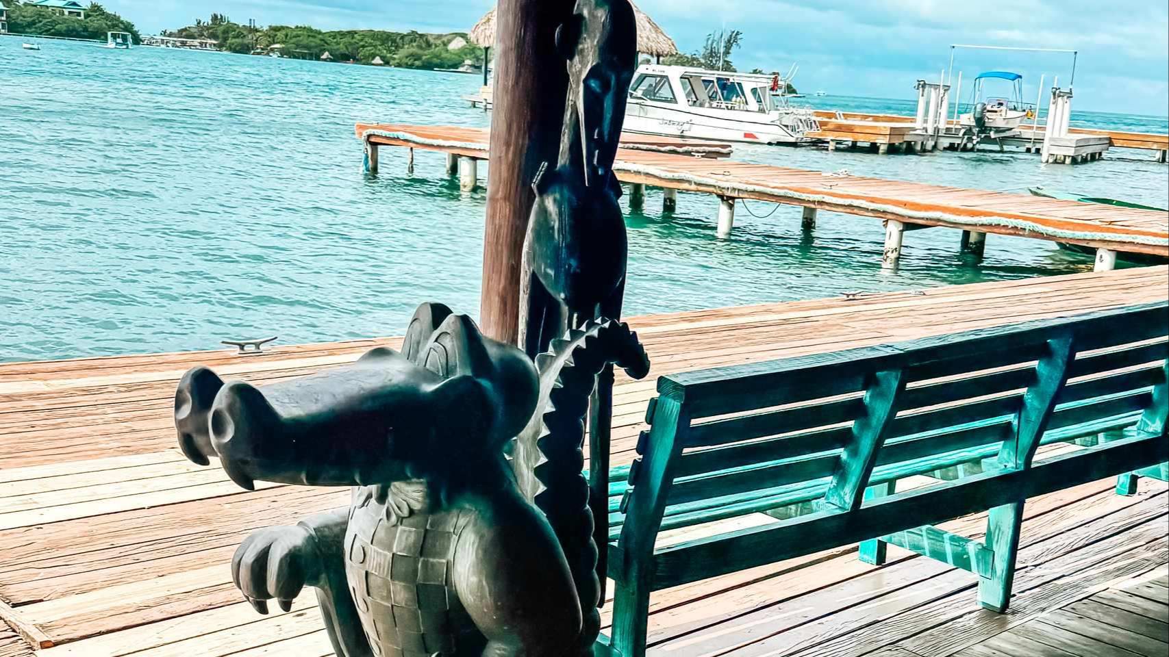 Little French Key Roatan: Professor Melissa standing on a colorful dock over turquoise water