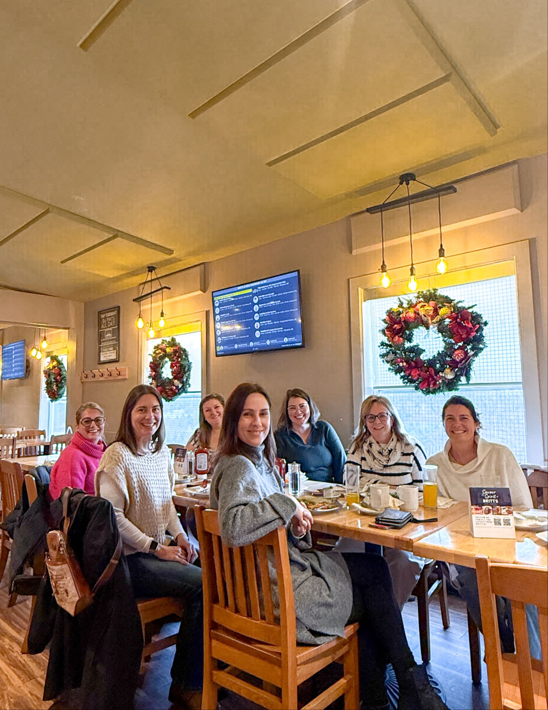 Women business owners having genuine conversation at The Roundabout networking event in Saint John"