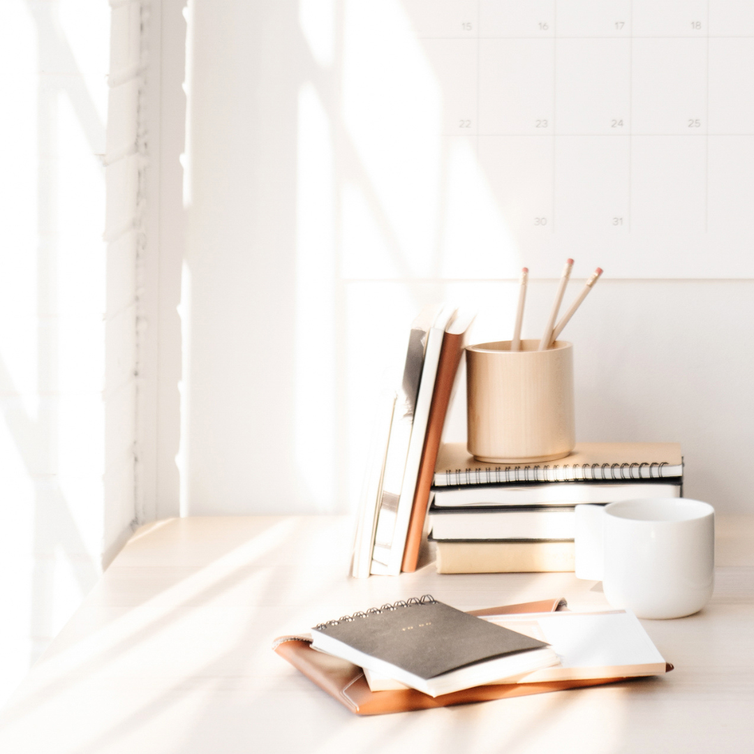 desk with open laptop showing "HighVibe Copy" on the screen