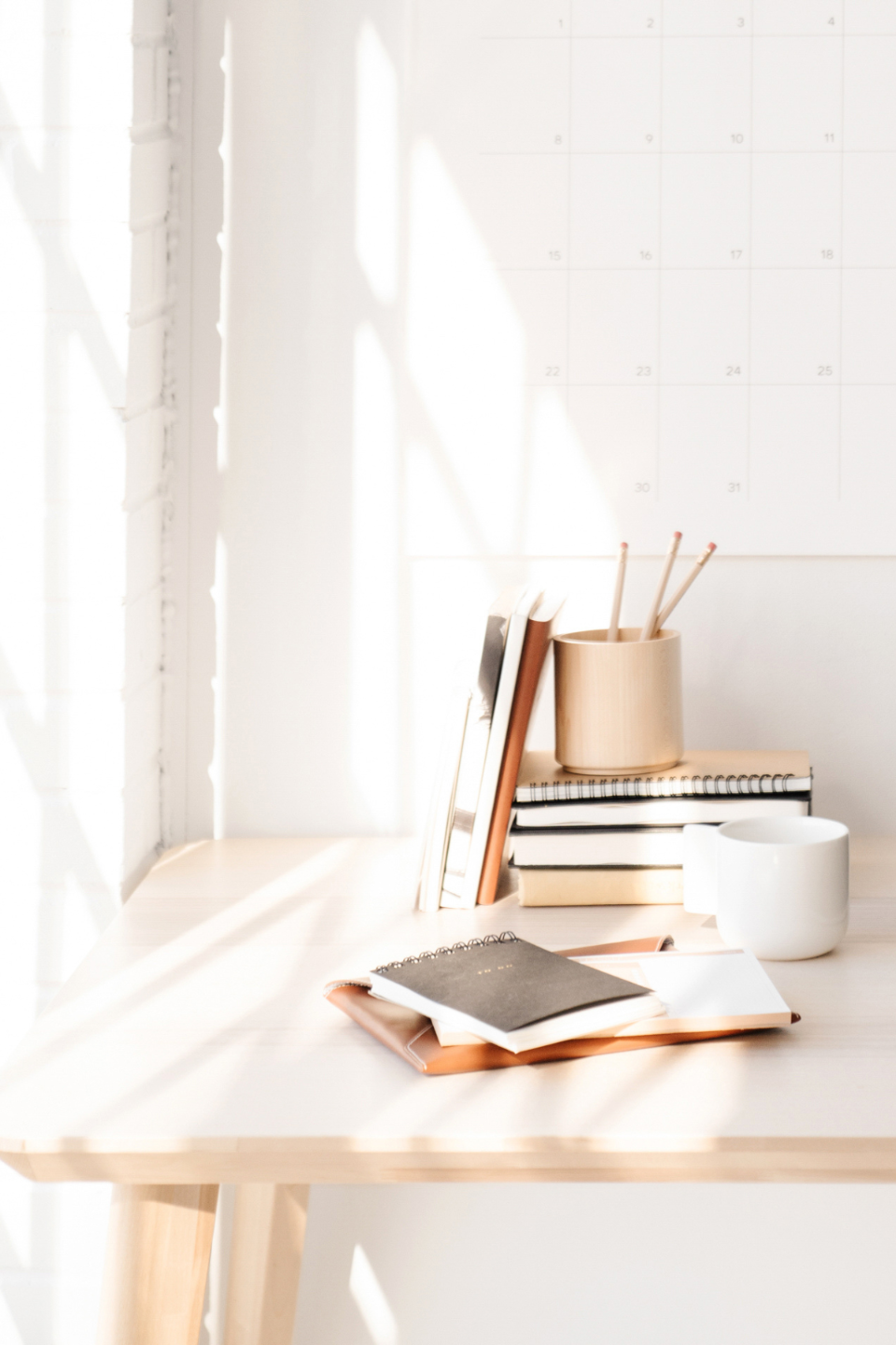desk with open laptop showing "HighVibe Copy" on the screen