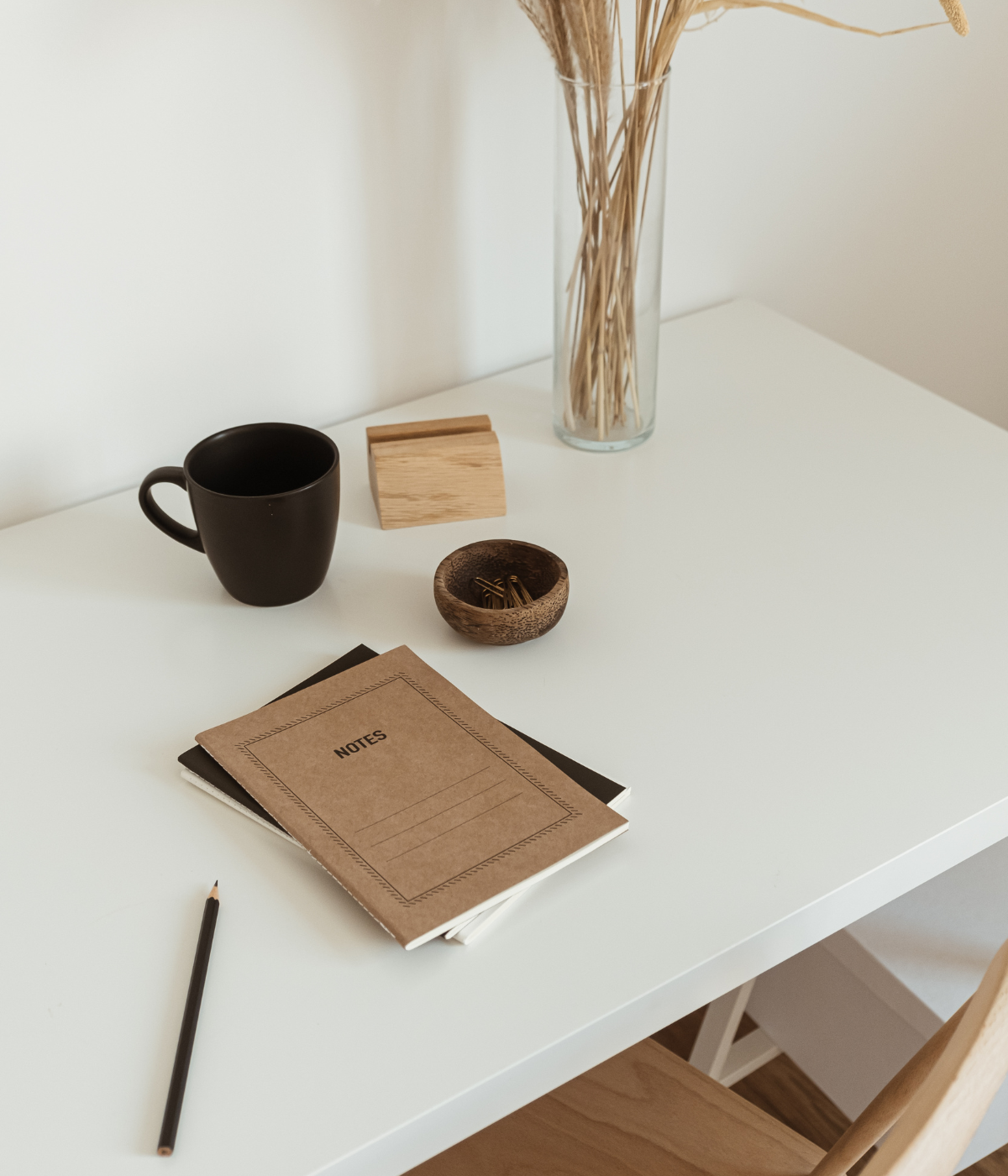 Notebook and pen on desk ready to write