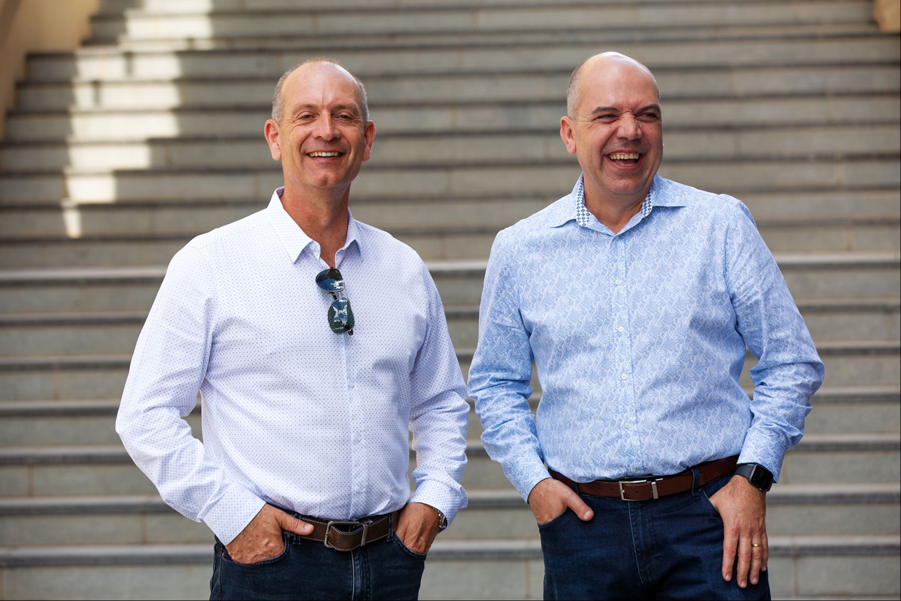 David Crook and Harry Raftos having a coffee outside in a Newcastle venue