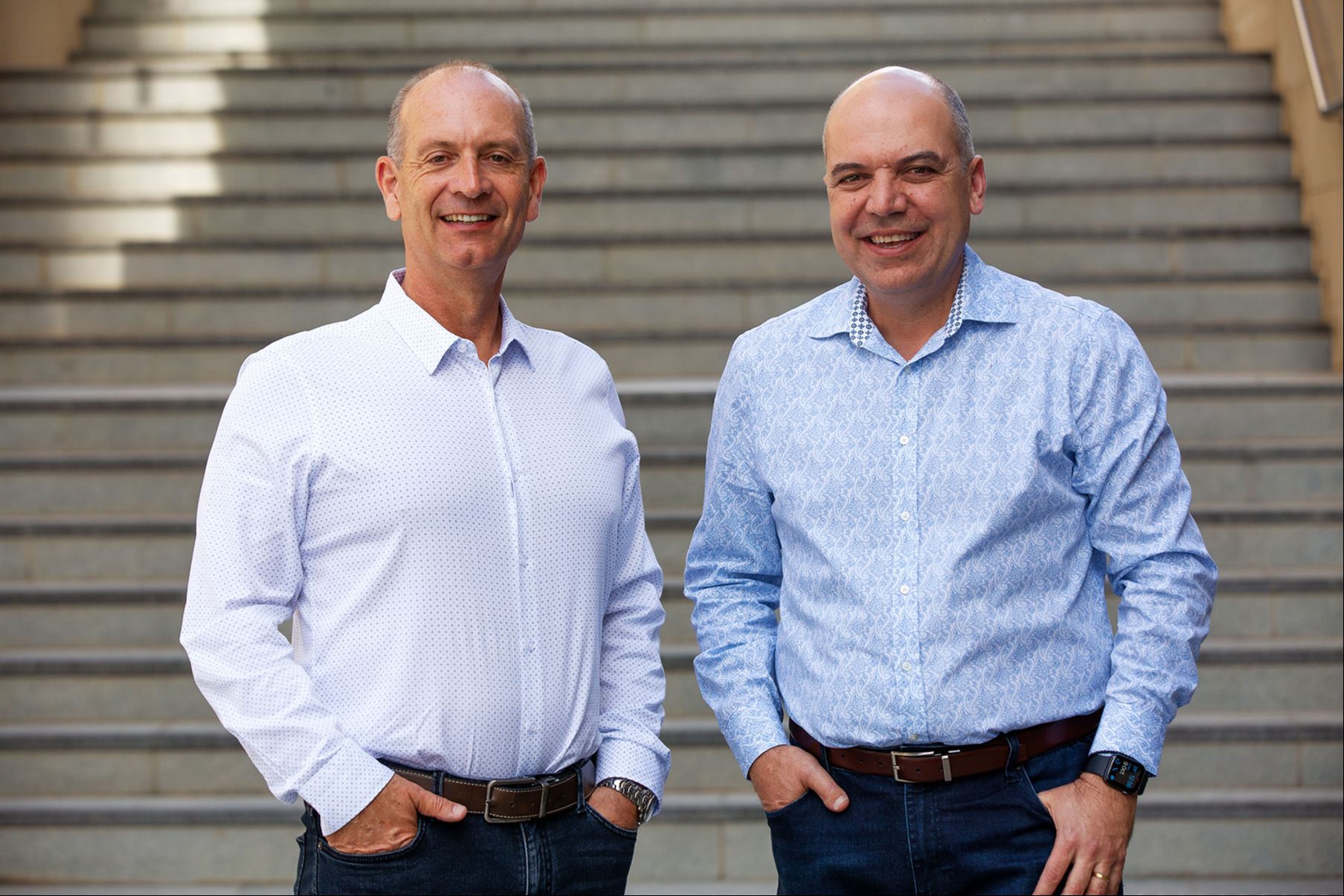 David Crook and Harry Raftos having a coffee outside in a Newcastle venue
