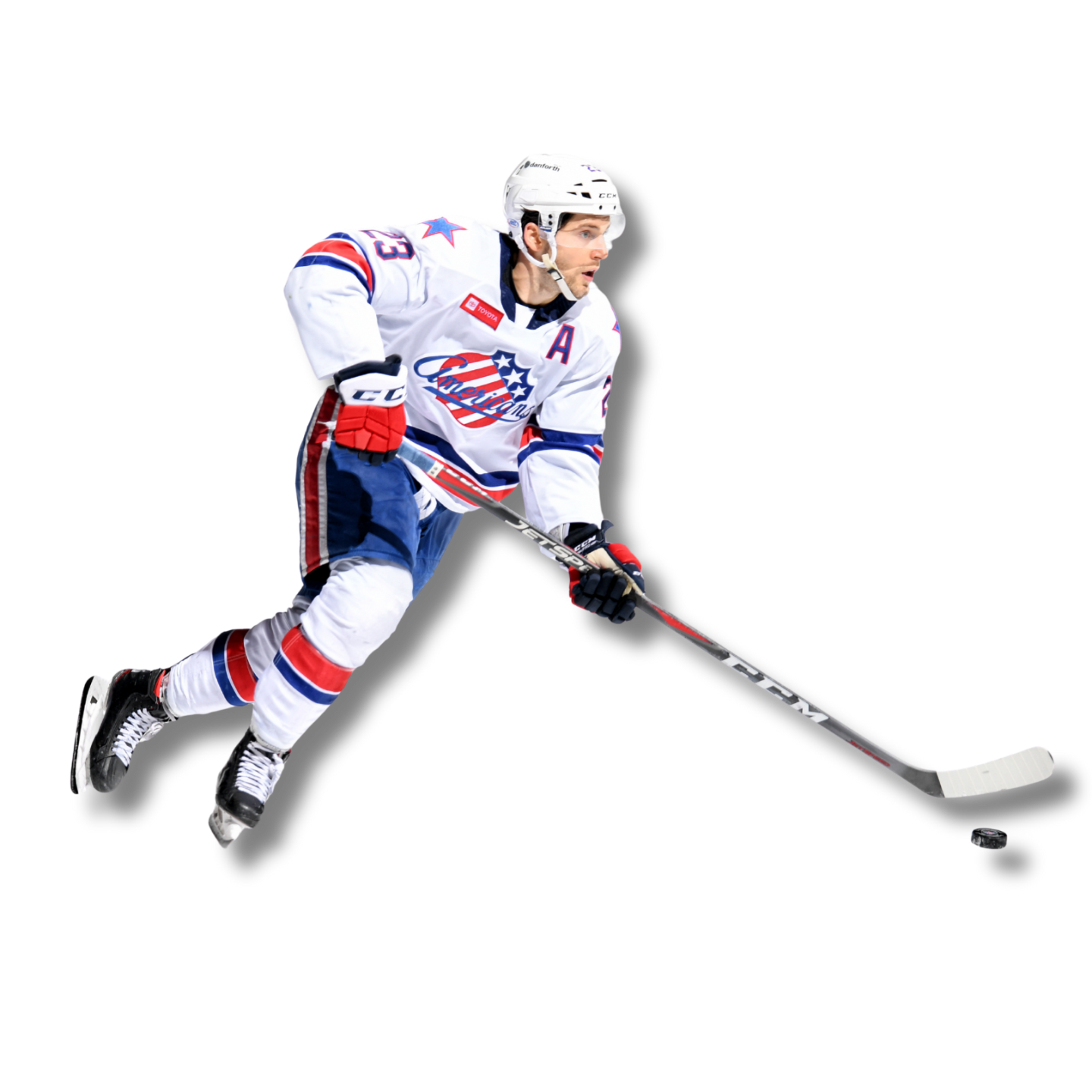 Hockey player skating with stick