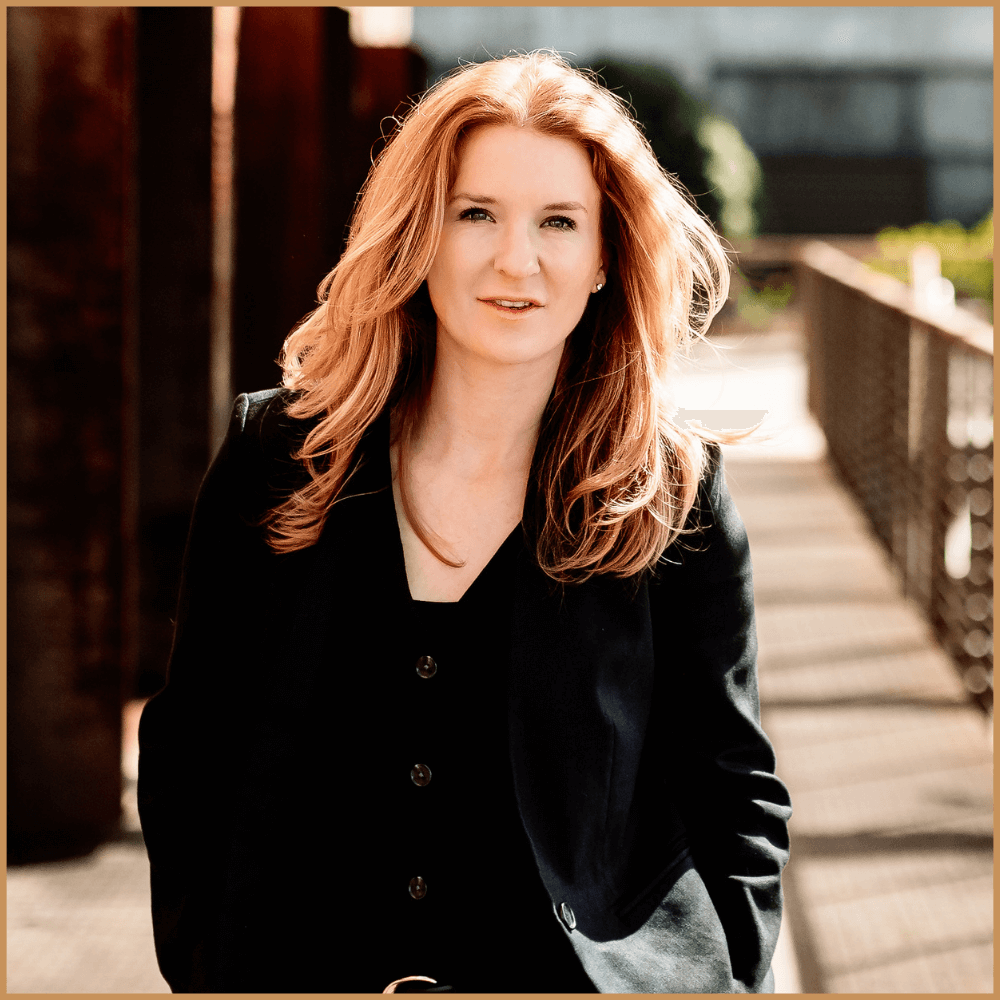 Woman overlooking cityscape at sunset, representing EMDR therapy, Internal Family Systems (IFS) healing, and trauma-informed care.