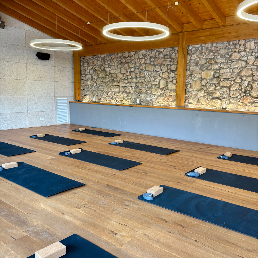 An indoor studio with wooden flooring for yoga and workshops at Yourself Yoga’s menopause wellness retreat near Barcelona