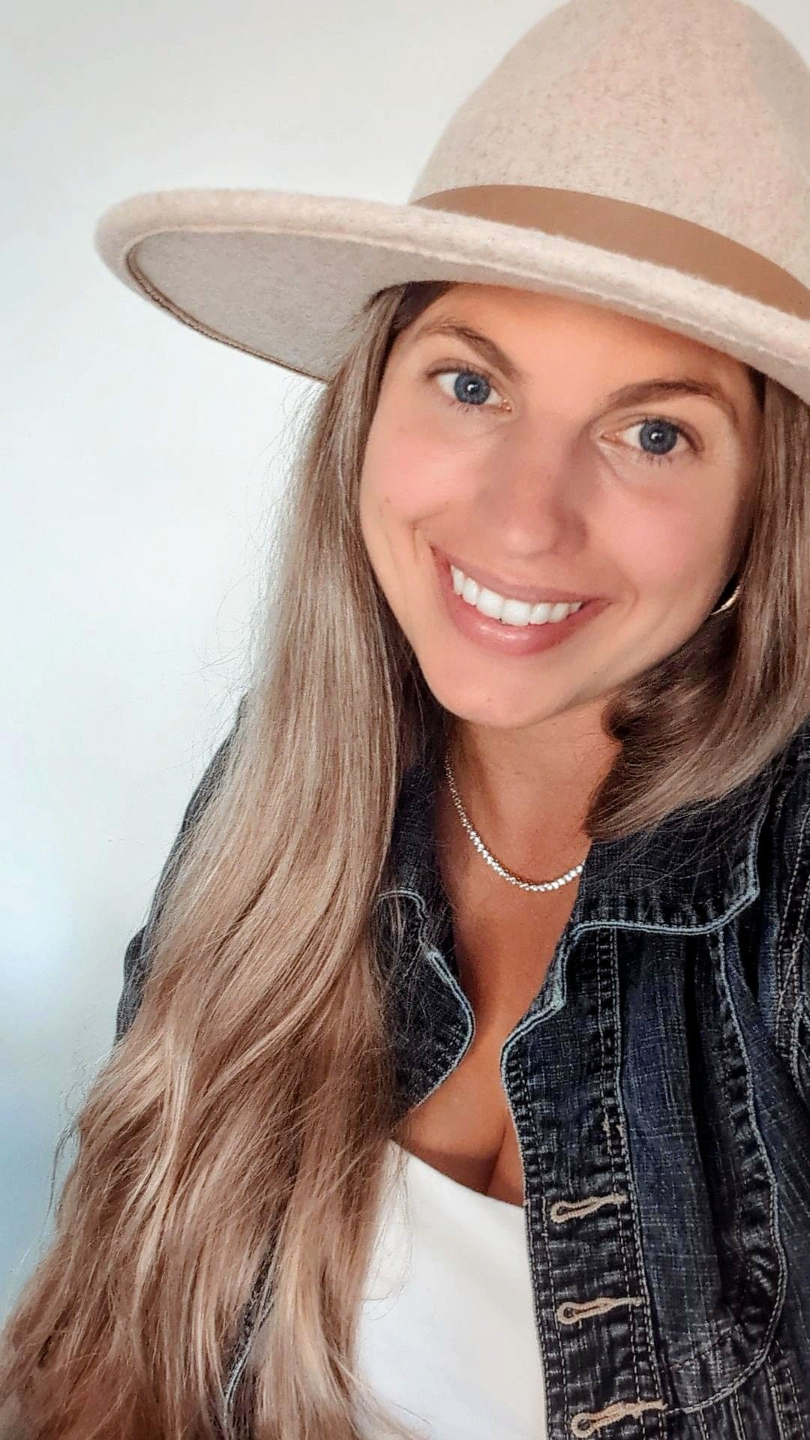 woman grinning looking away