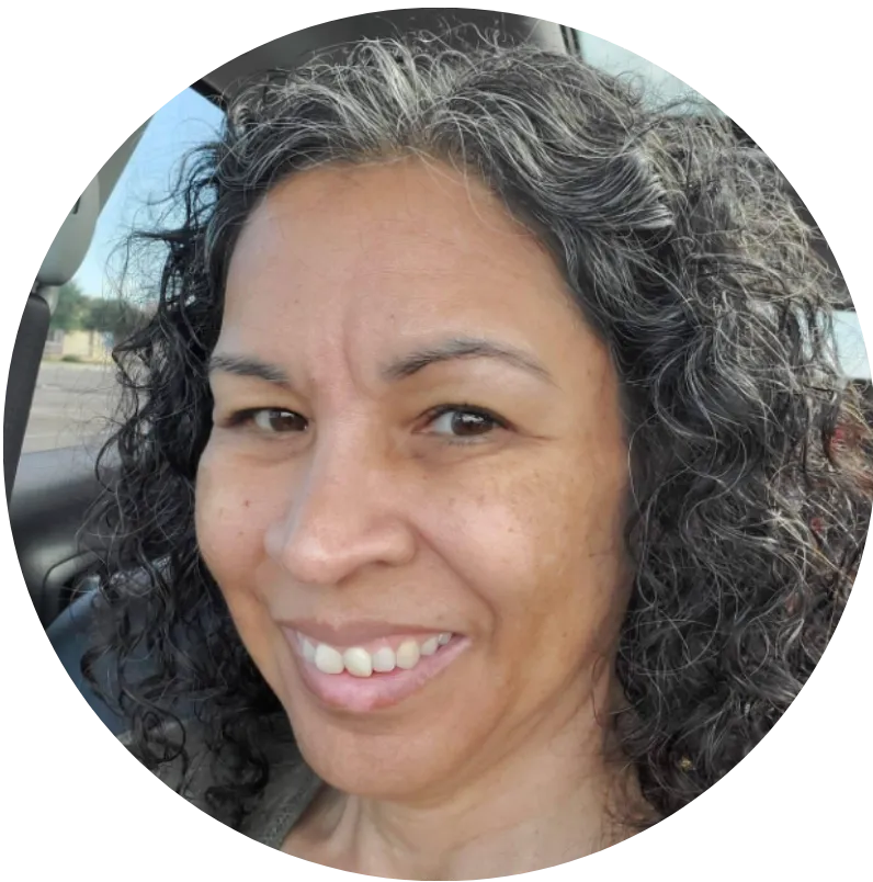 Happy client standing with Paula Collins after a successful healing session.