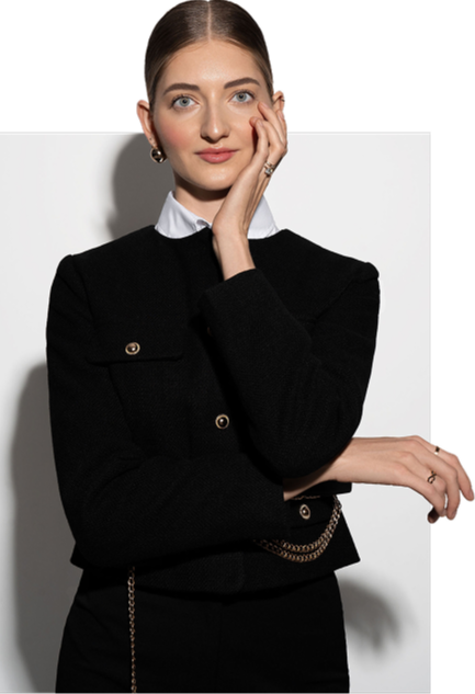 Photo of Valeriia with her hands tucked behind her ear