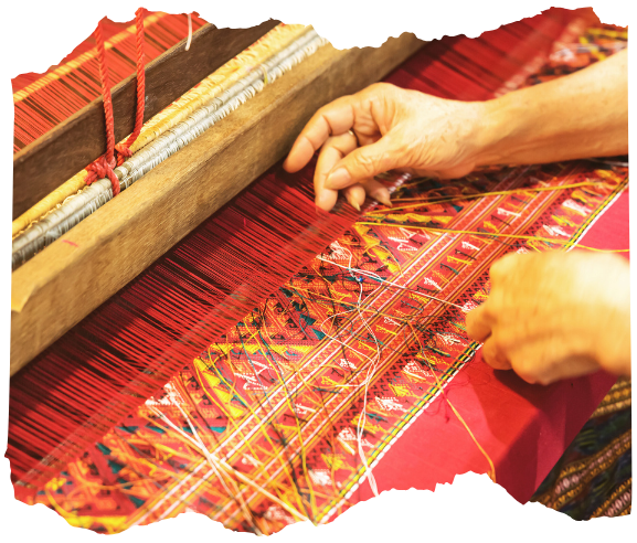 Hands working on a red woven textile, representing ceremony templates, offering guides, and practical shamanic tools included in the course.