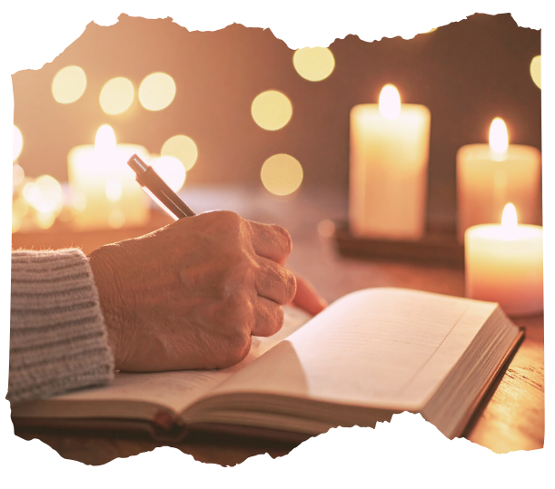 Open journal with glowing candles, symbolizing printable study guides and reflection prompts for the Way of the Shaman course.