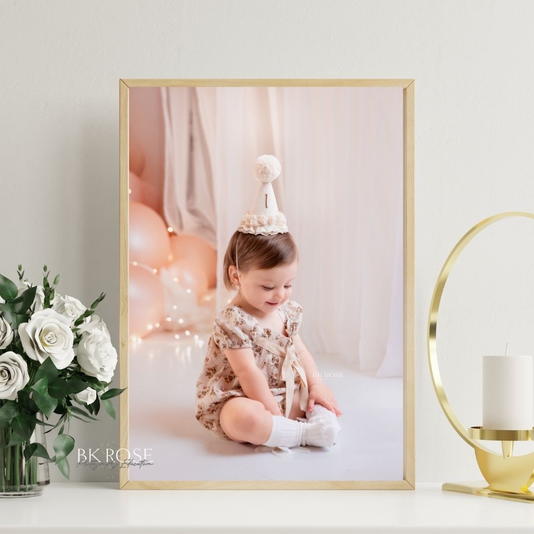 baby hands on a birthday cake