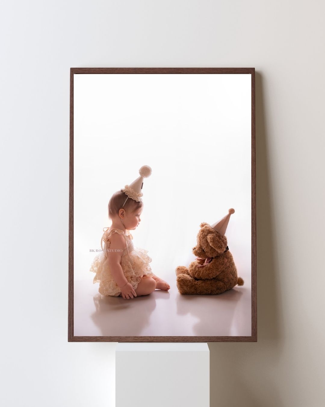 baby hands on a birthday cake