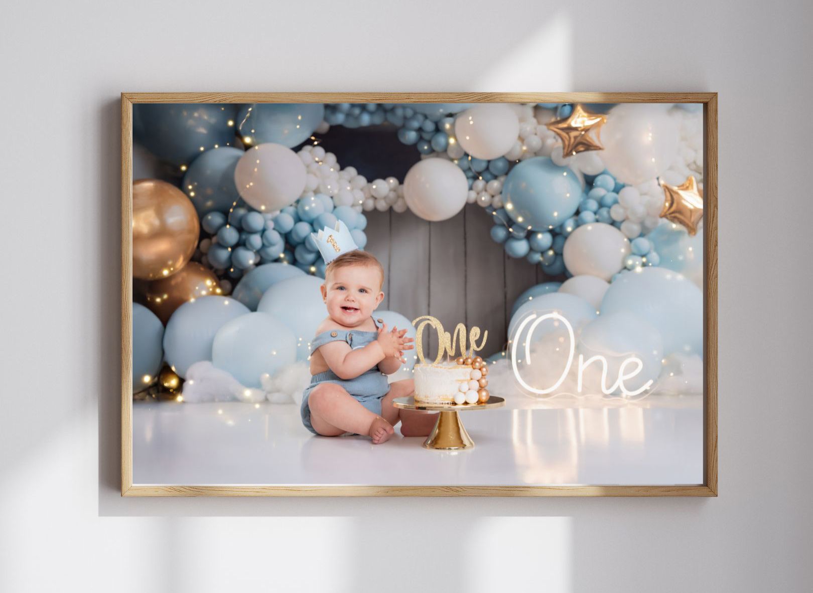 one year old girl eating birthday cake looking off to the side of camera