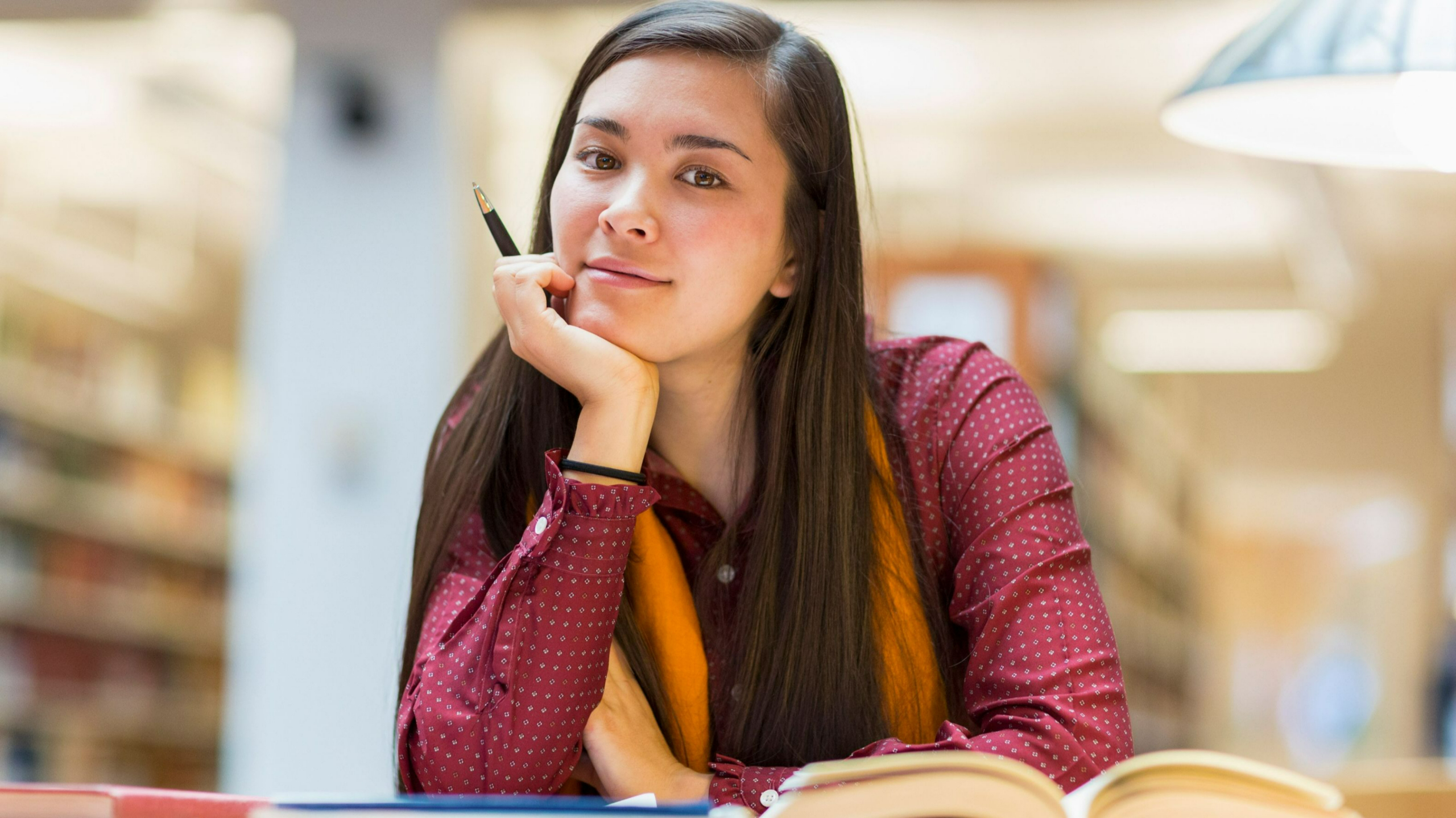 "Woman reading, symbolizing reflection and personal growth.”