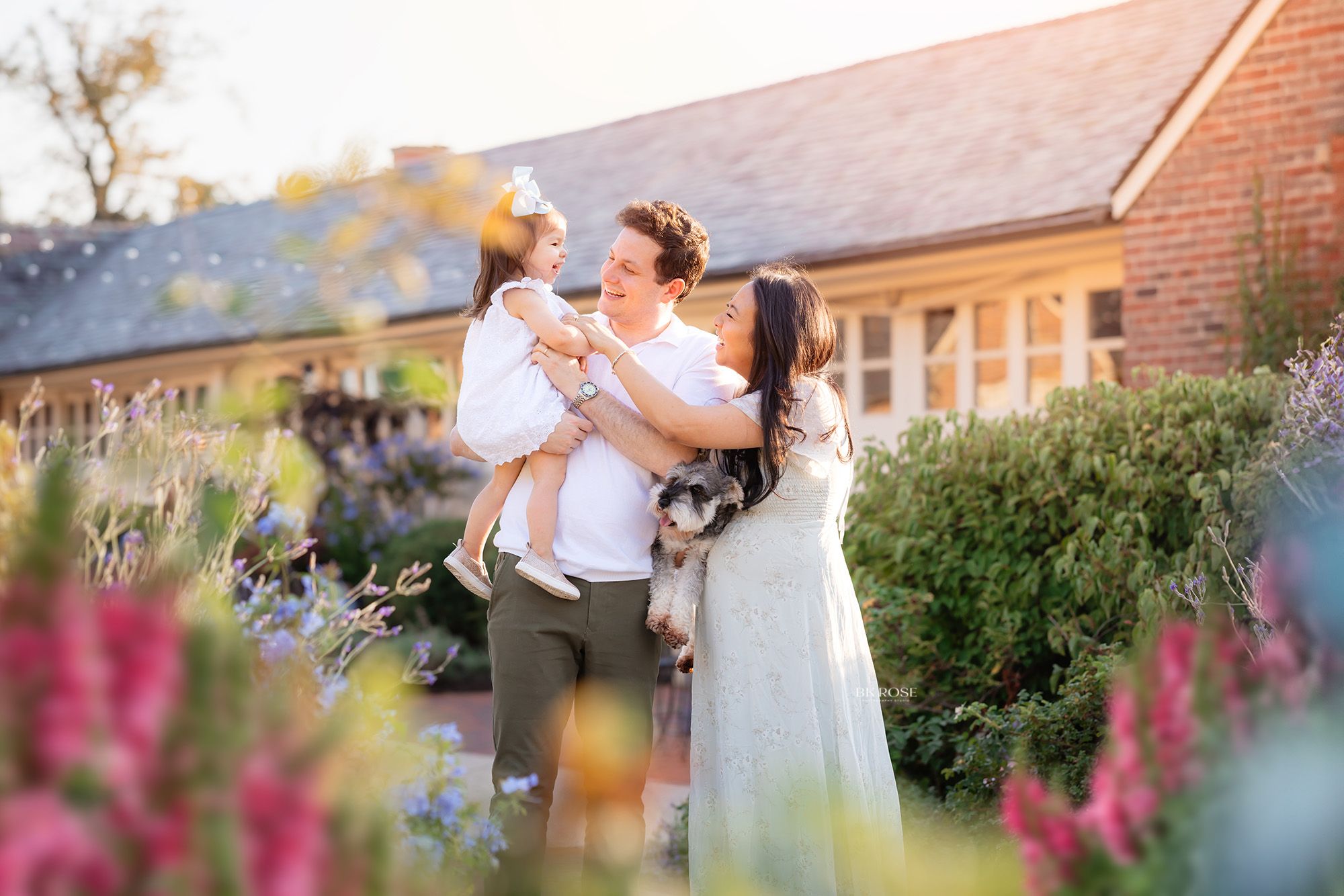 family of three looking at each other