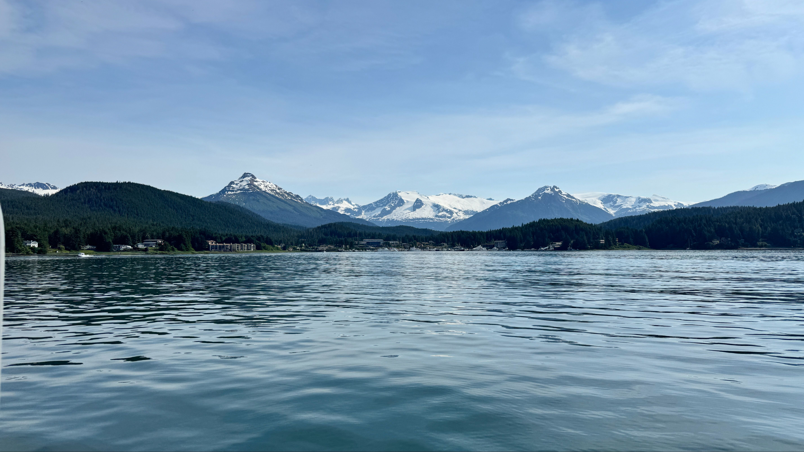 Juneau Cruise Port - calm waters with snow-capped mountains in the distance.