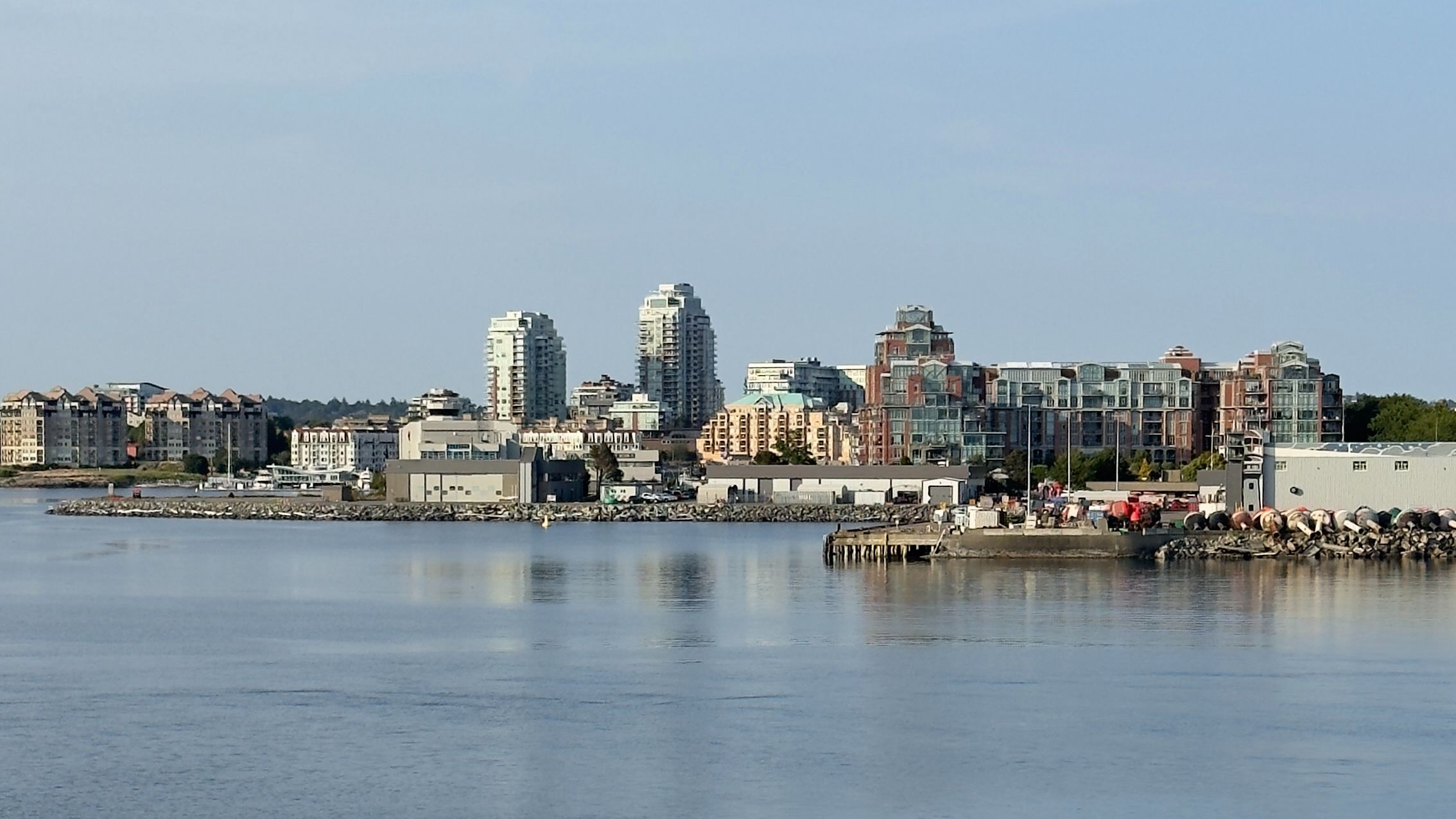 Victoria Cruise Port: City skyline and waterfront buildings viewed from the harbor.