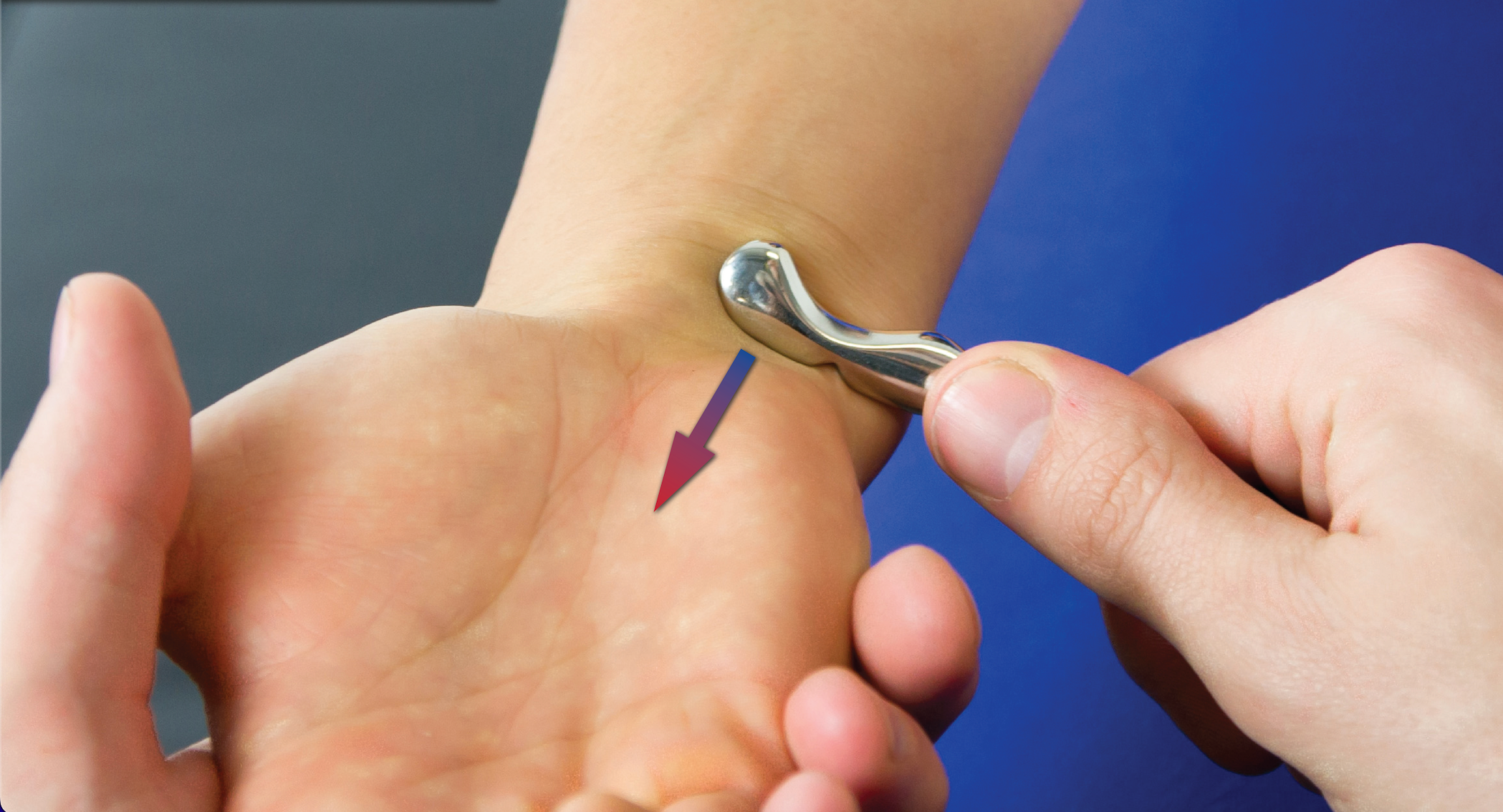 Manual therapist applying IASTM techniques.