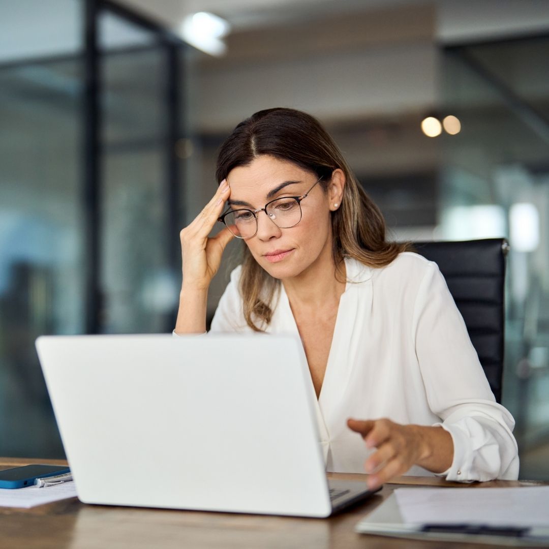 Table with cinnamon roll and mug of coffee
