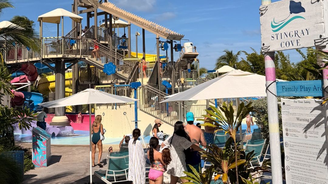 Baha Bay at Baha Mar: Stingray Cove splash zone with water slides, play structures, and families enjoying the sunny day