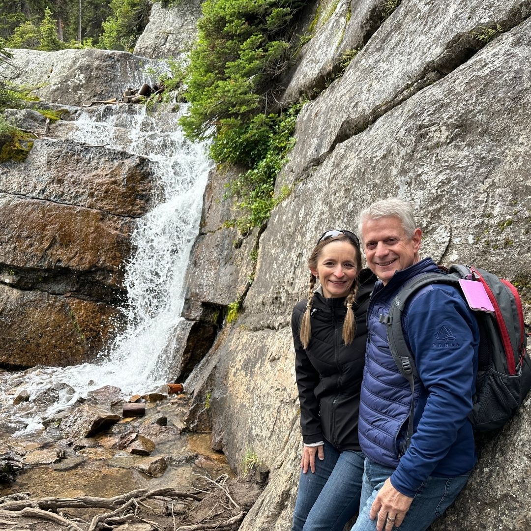 woman's hands at laptop with financial reports