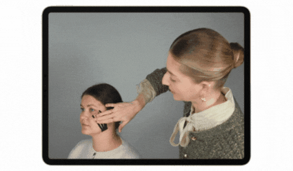 image of Valeriia using Gua Sha on her face