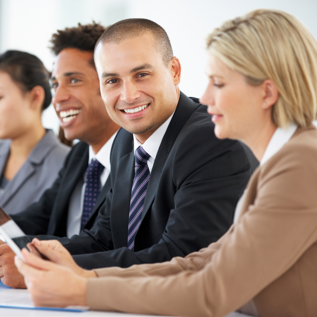 Group of professionals in a finance meeting discussing sustainability reporting