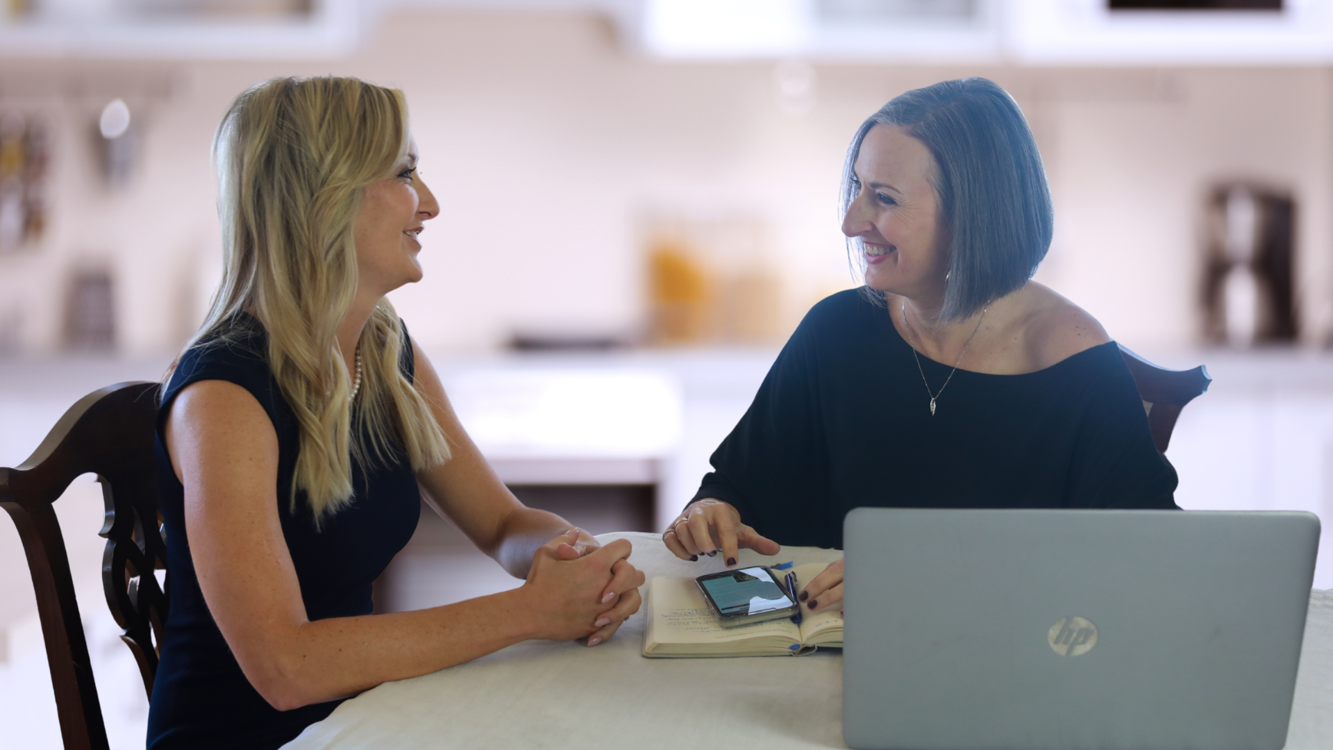 Melissa sitting with client