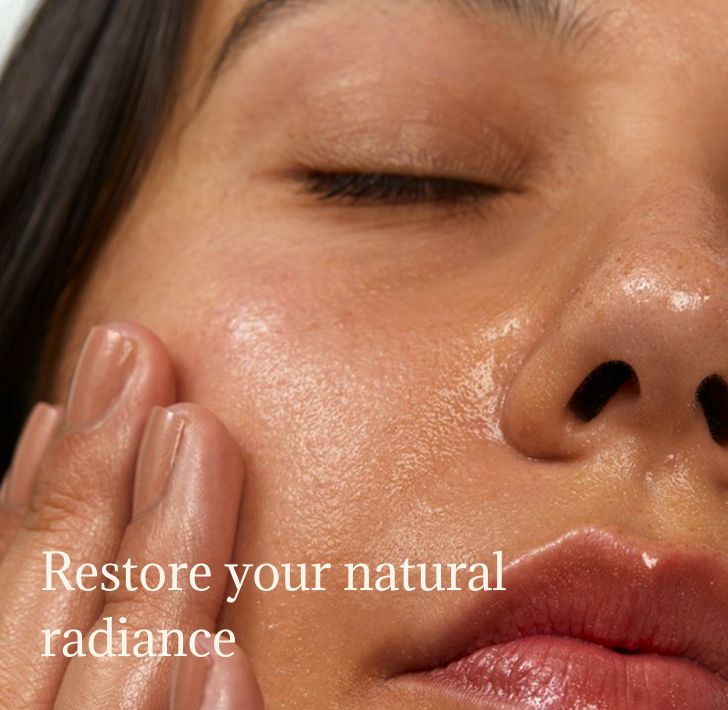 Woman with glowing, fresh skin after her morning skincare ritual