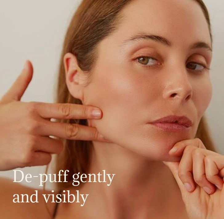 Woman performing a gentle facial massage to reduce morning puffiness