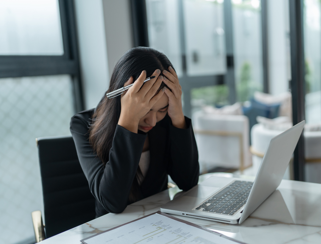 person frustrated at laptop