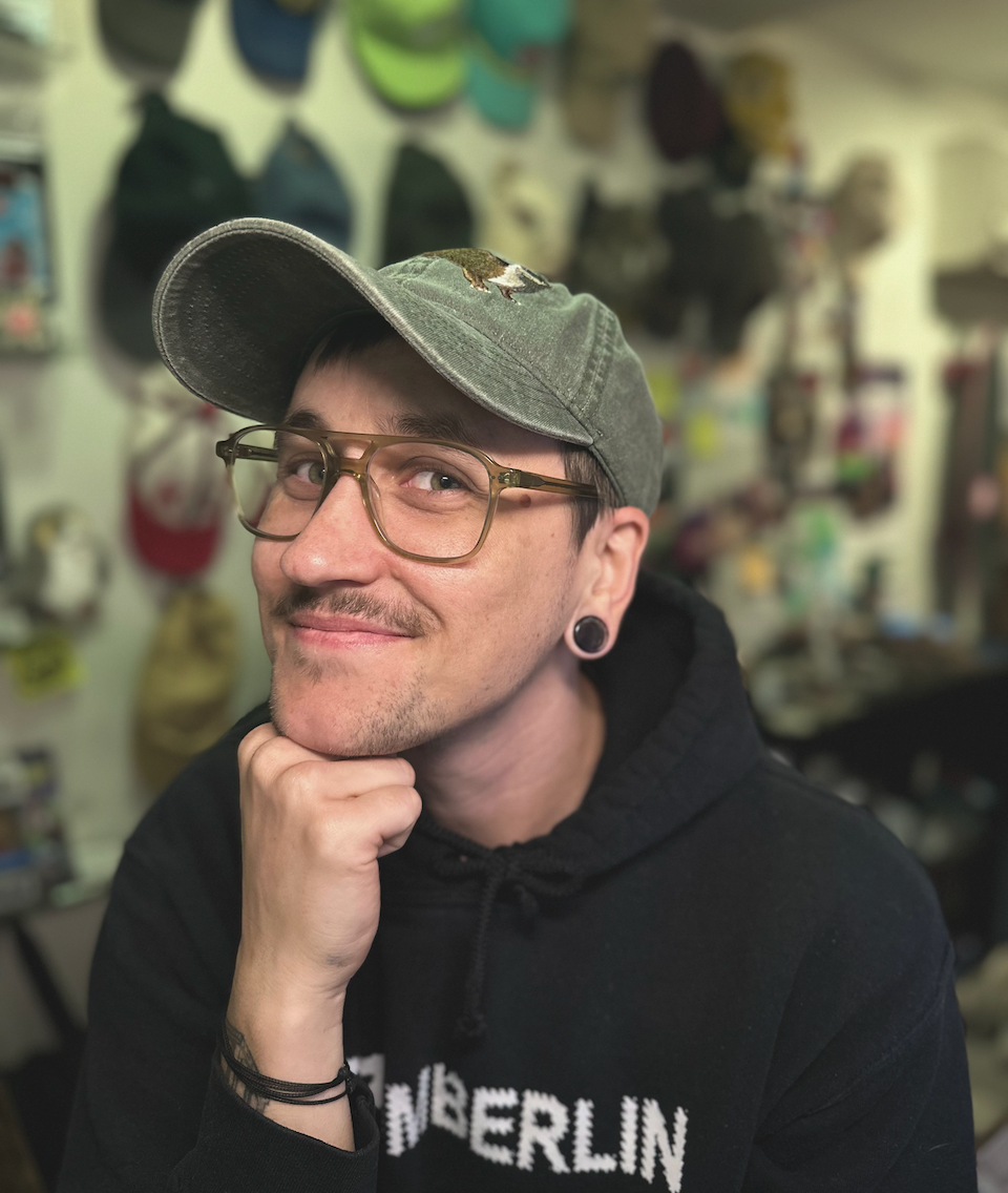 Abby Covert, chief sensemaker sitting in front of a bookshelf