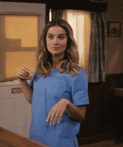 GIF of a Woman Excitedly Listening to an Opportunity That's Peaker Her Interest