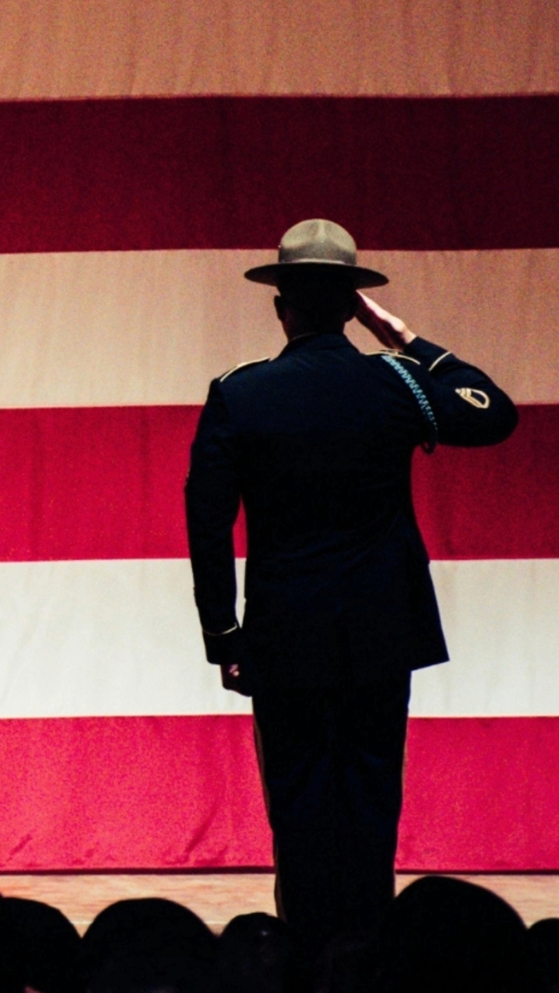 solider saluting the American flag