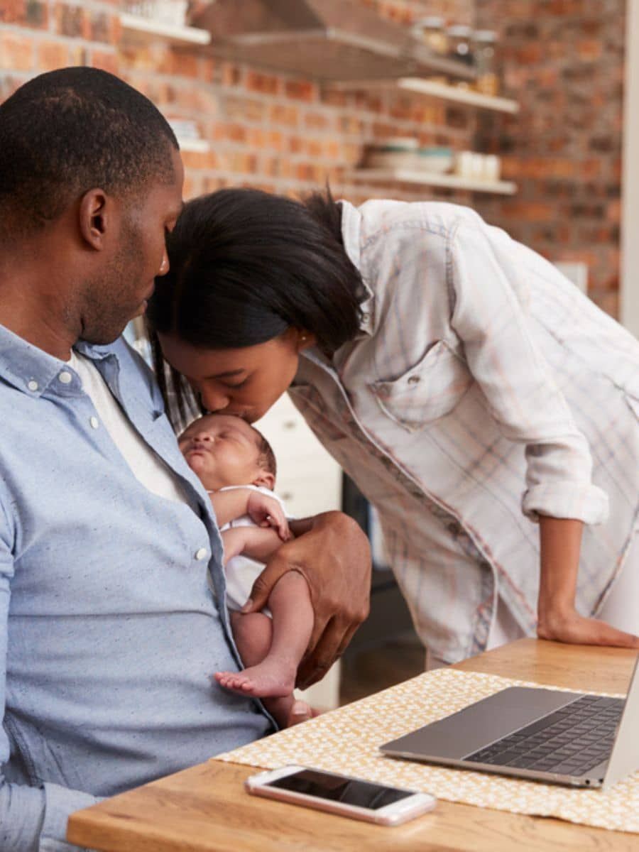 Mother joyfully holding her baby, showcasing a successful pain-free latch after the Reflexive™ Latching Masterclass.