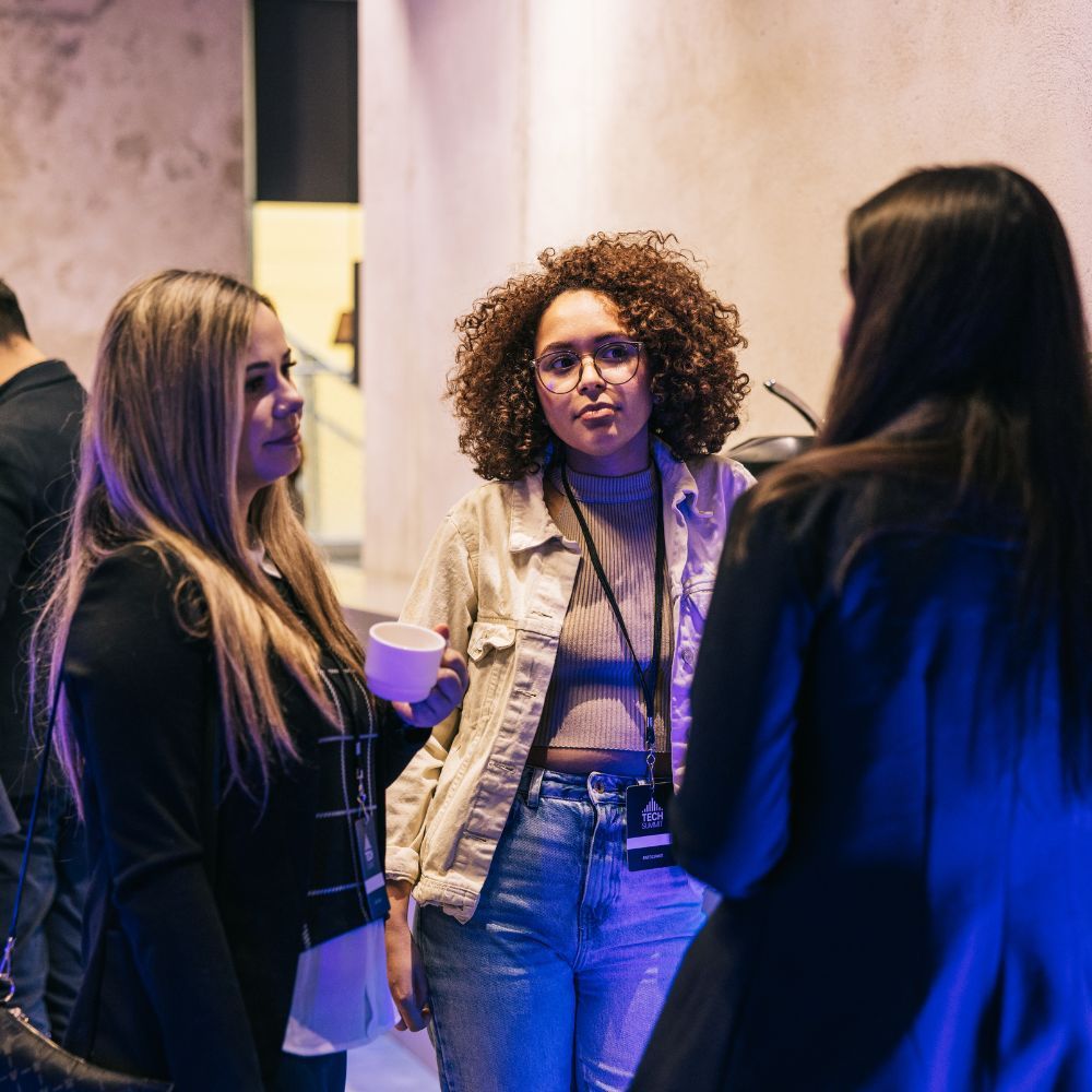 3 young women talking and networking