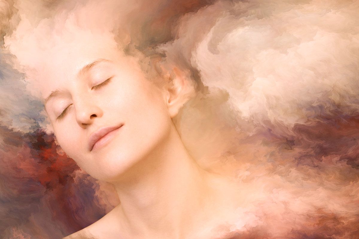 Abstract image of woman with closed eyes on a blurred background.