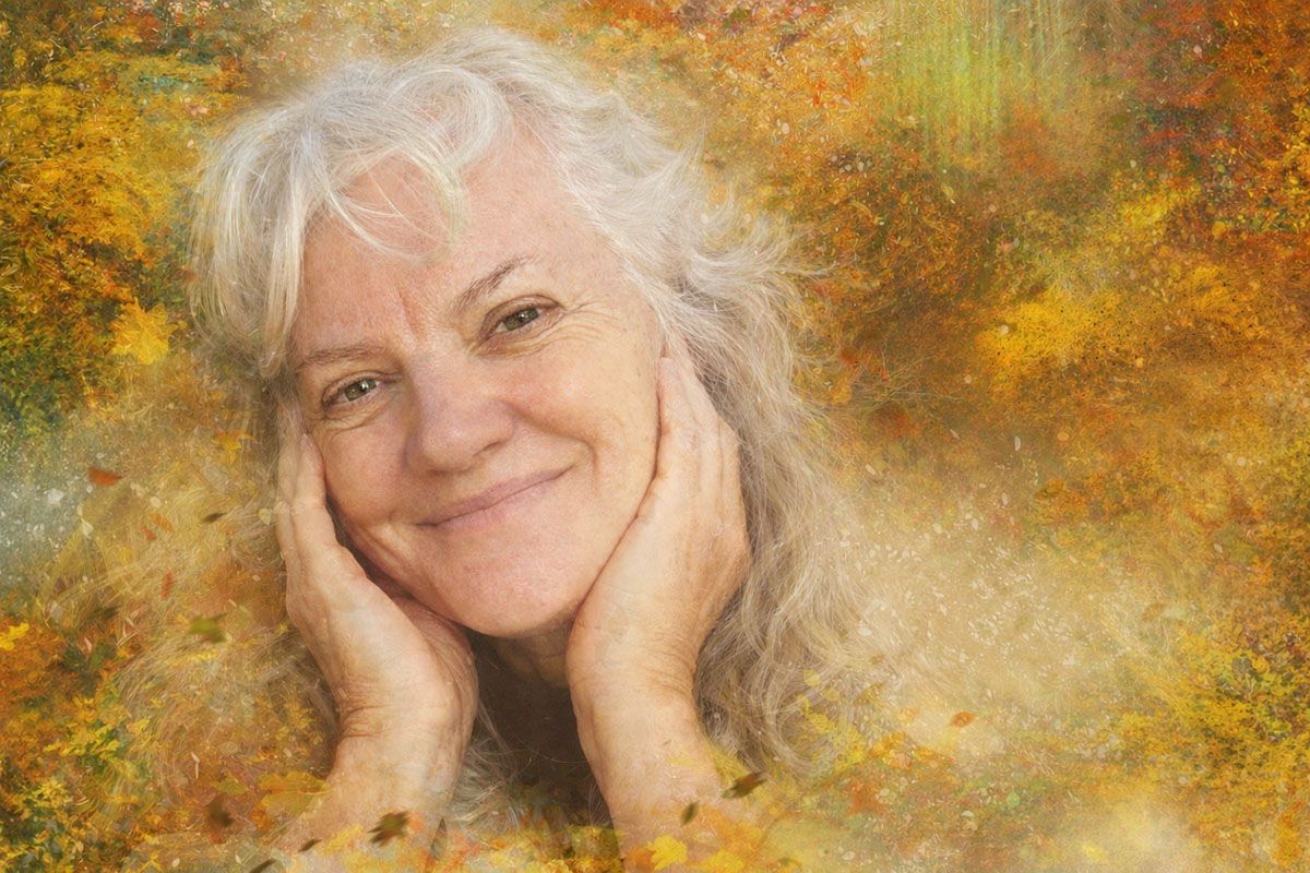 Artistic image depicting Deborah Christensen amid a surreal autumn-themed background. 