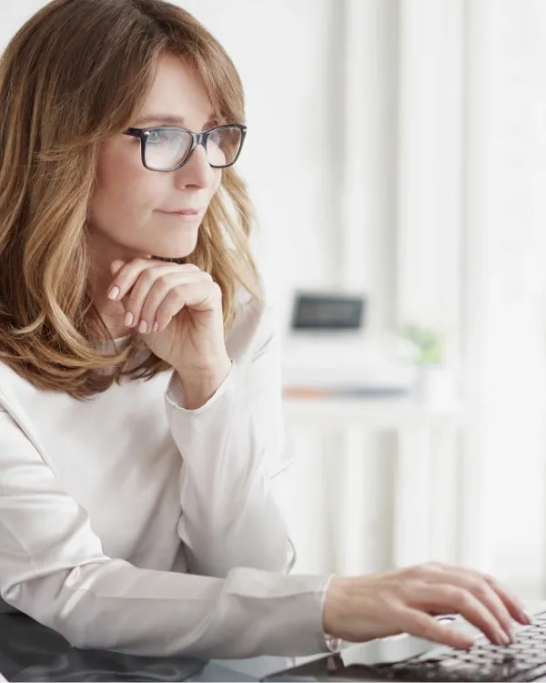 woman typing on her laptop