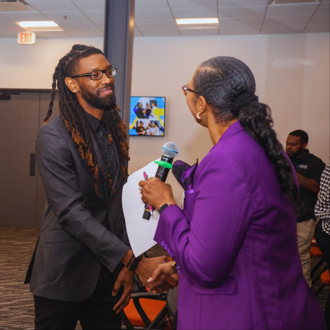 Dr. Michael Thompson speaking or preparing in front of the Road to WHY broadcast setup.