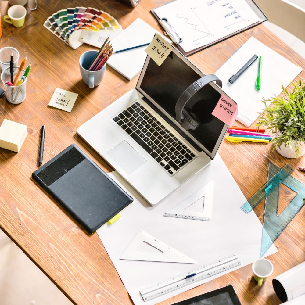 Busy desk with lots of notes