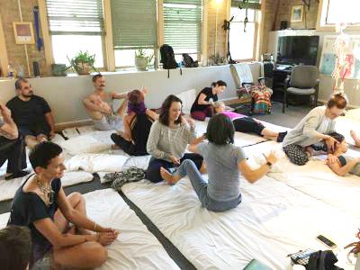 Doug Ringwald treating a female client's shoulder pain with bodywork in Aurora, CO