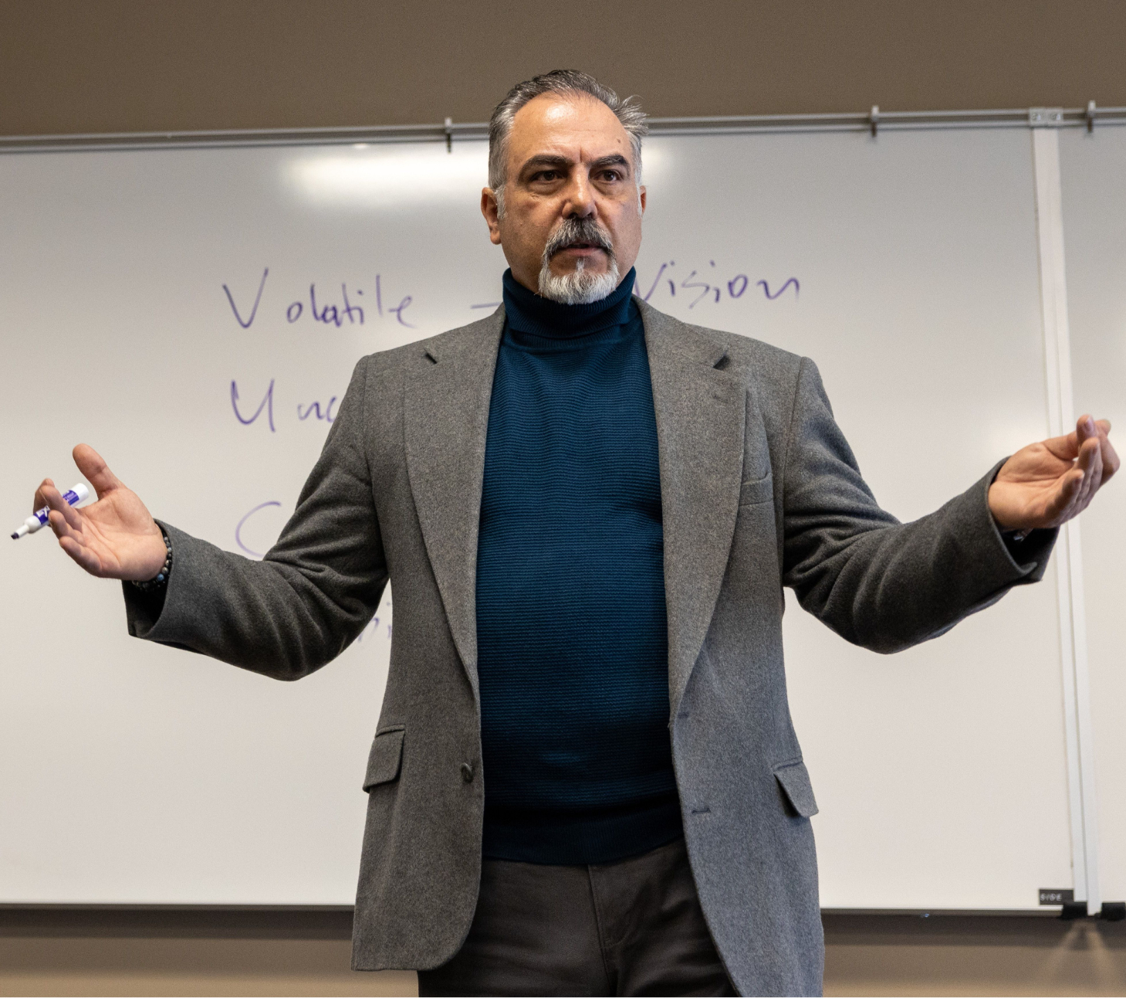 Kon Apostolopoulos Speaking at Workshop with Arms Up