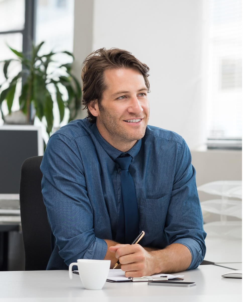Confident, relaxed man at desk
