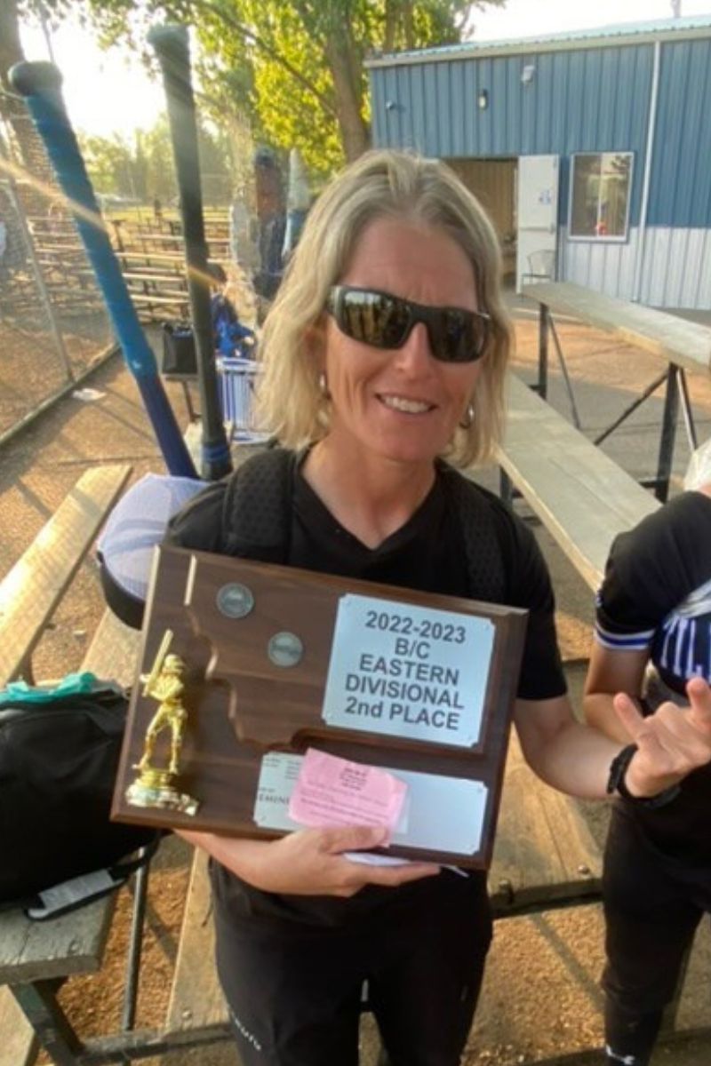 Unbreakable Mental Strength Founder Rochelle Gravance Holding a 2022-2023 B/C Easter Divisional 2nd Place Trophy  